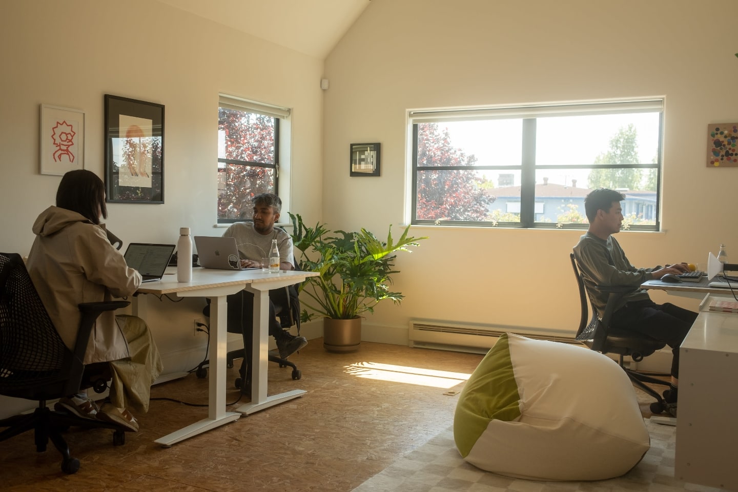 The three Posts.cv's founders working together in a sunny room.